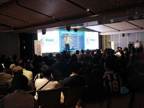 Dries Buytaert speaking at DrupalCon Singapore 2024, photo by Jakub Piasecki