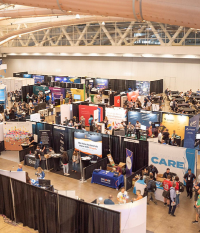 Photo of sponsorship booths in expo hall at DrupalCon.